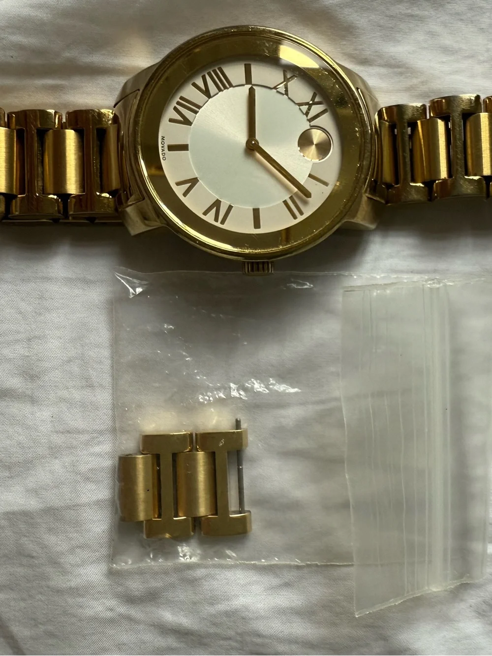 Movado Bold gold watch with box and card